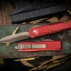 Microtech UTX-85 OTF Automatic Knife Red 3.1" Dagger Bronze 232-13RD 2 Microtech UTX-85 OTF Automatic Knife Red 3.1" Dagger Bronze 232-13RD -Southern Blades 232 13 RD 85111.1679521790
