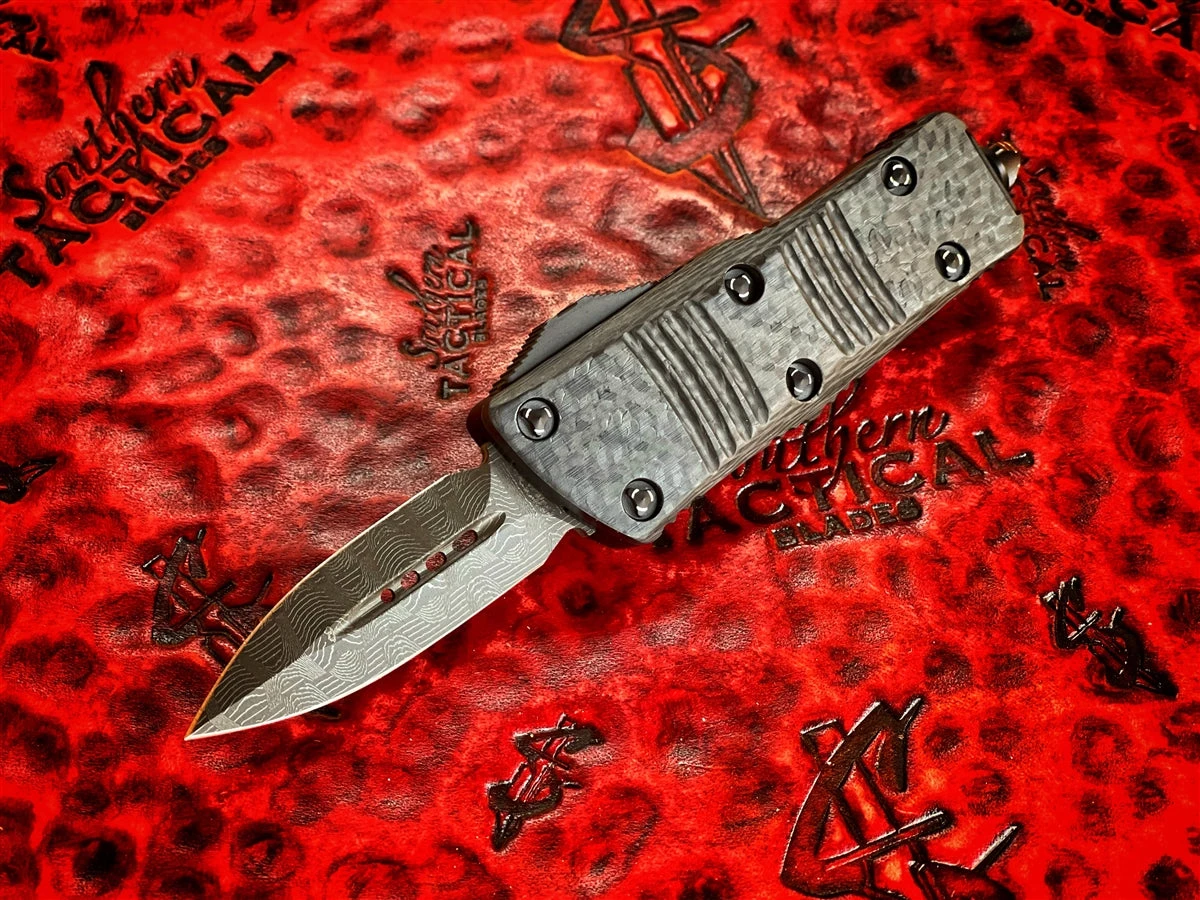 Microtech Mini Troodon Double Edge Damascus W/ Carbon Fiber Top Standard Signature Series 3 Microtech Mini Troodon Double Edge Damascus W/ Carbon Fiber Top Standard Signature Series