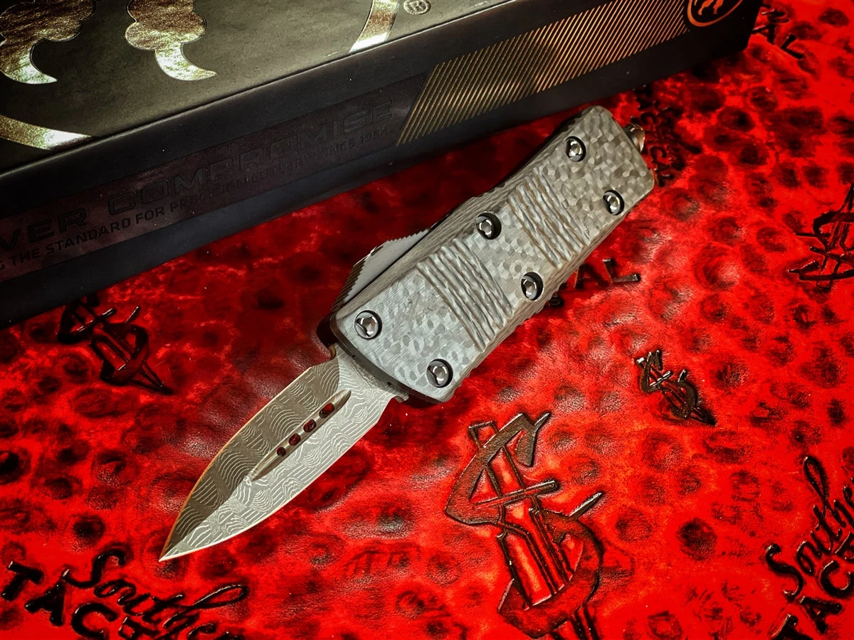 Microtech Mini Troodon Double Edge Damascus W/ Carbon Fiber Top Standard Signature Series 4 Microtech Mini Troodon Double Edge Damascus W/ Carbon Fiber Top Standard Signature Series - Image 2