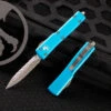 Microtech UTX-70 OTF Automatic Knife Turquoise 2.4" Dagger Stonewash Serrated 147-12TQ 1 Microtech UTX-70 OTF Automatic Knife Turquoise 2.4" Dagger Stonewash Serrated 147-12TQ -Southern Blades IMG 4349 42798.1660923481