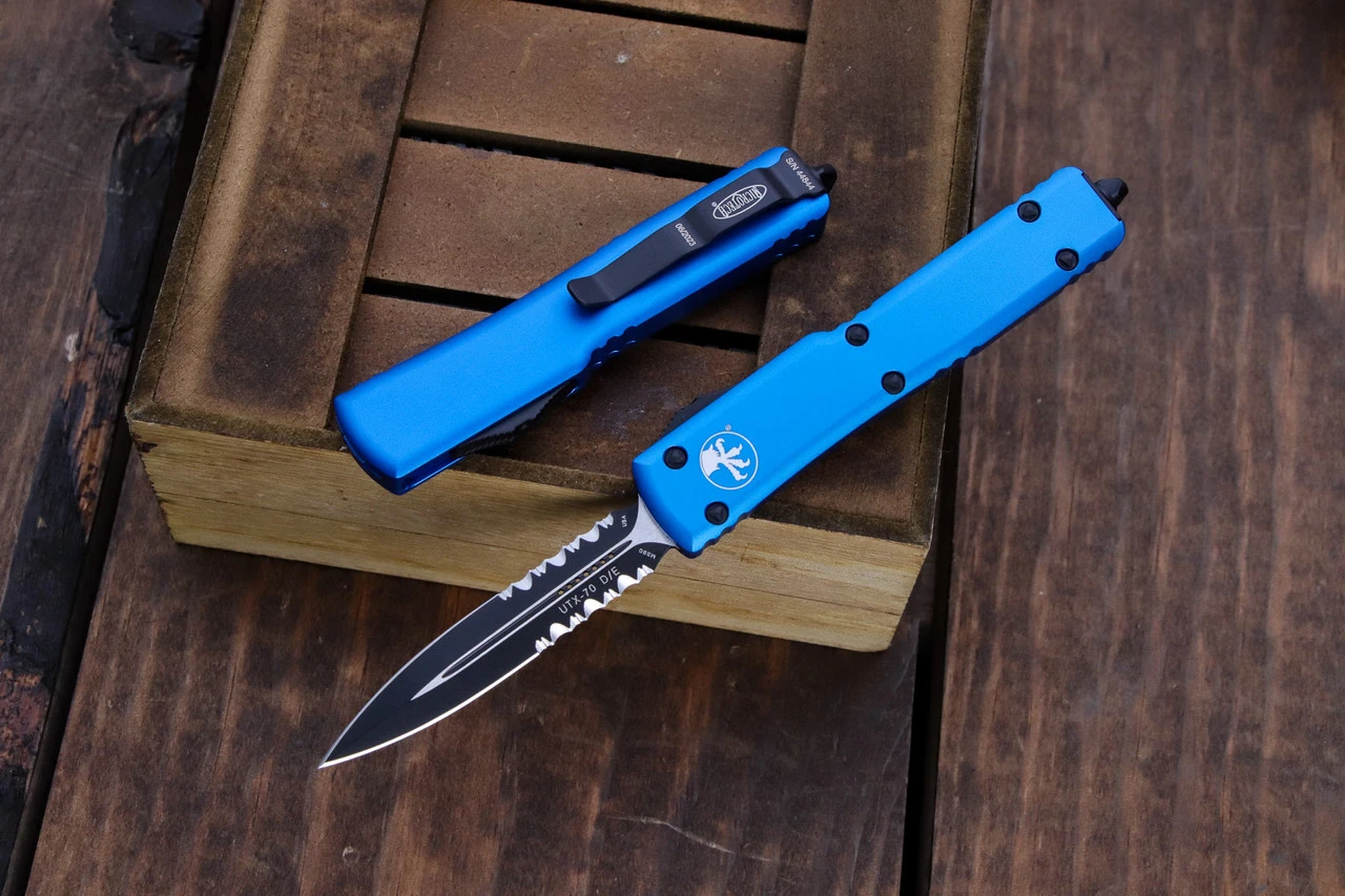 Microtech UTX-70 OTF Automatic Knife Blue 2.4" Dagger Serrated Black 147-2BL 3 Microtech UTX-70 OTF Automatic Knife Blue 2.4" Dagger Serrated Black 147-2BL