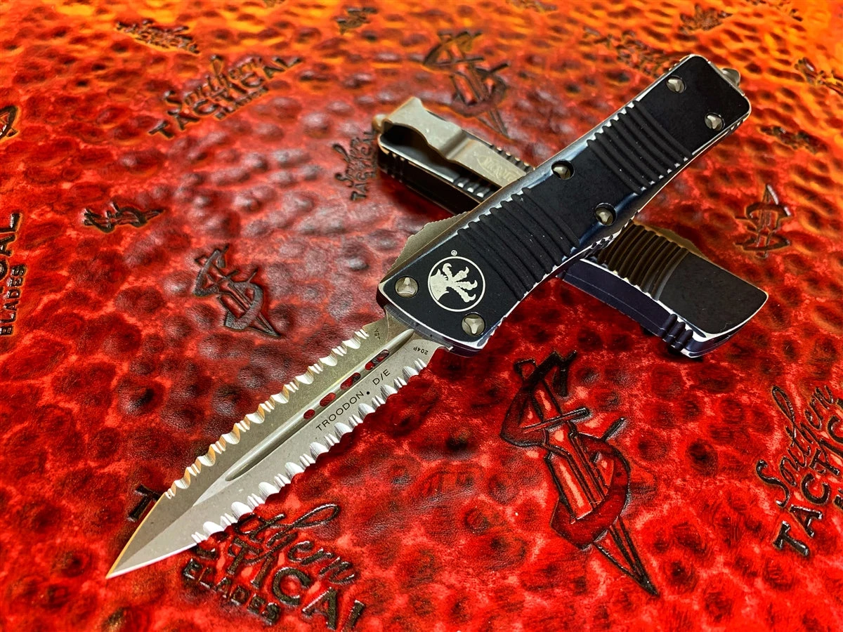 Microtech Troodon Double Edge Stonewashed Double Full Serrated Distressed Black 3 Microtech Troodon Double Edge Stonewashed Double Full Serrated Distressed Black