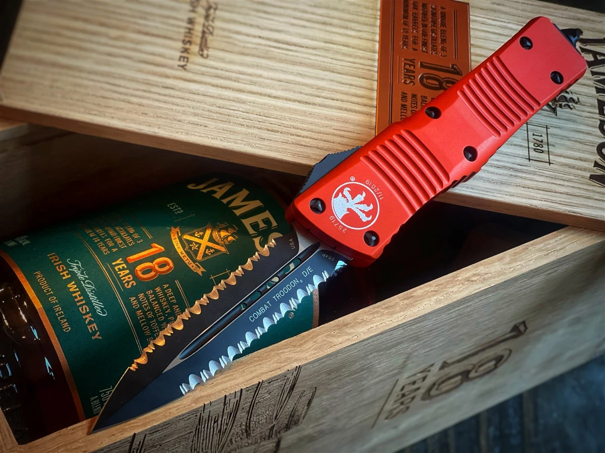 Microtech Combat Troodon OTF Automatic Knife Double Edge Double Full Serrated Blade Orange Anodized Chassis 3 Microtech Combat Troodon OTF Automatic Knife Double Edge Double Full Serrated Blade Orange Anodized Chassis