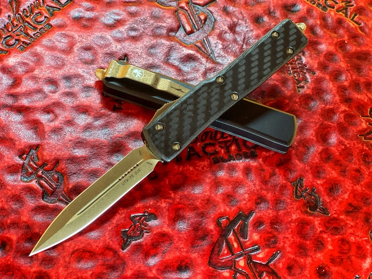 Microtech UTX-70 OTF Automatic Knife Double Edge Bronze Apocalyptic Standard Carbon Fiber Top Signature Series 3 Microtech UTX-70 OTF Automatic Knife Double Edge Bronze Apocalyptic Standard Carbon Fiber Top Signature Series