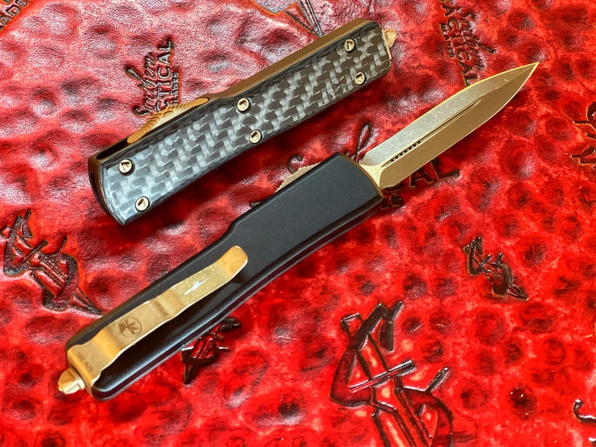 Microtech UTX-70 OTF Automatic Knife Double Edge Bronze Apocalyptic Standard Carbon Fiber Top Signature Series 4 Microtech UTX-70 OTF Automatic Knife Double Edge Bronze Apocalyptic Standard Carbon Fiber Top Signature Series - Image 2