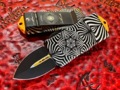 Microtech Exocet Double Edge, Two Toned Black W/ Gold Accents, Aircraft Allow W/ ‘Source’ Artwork