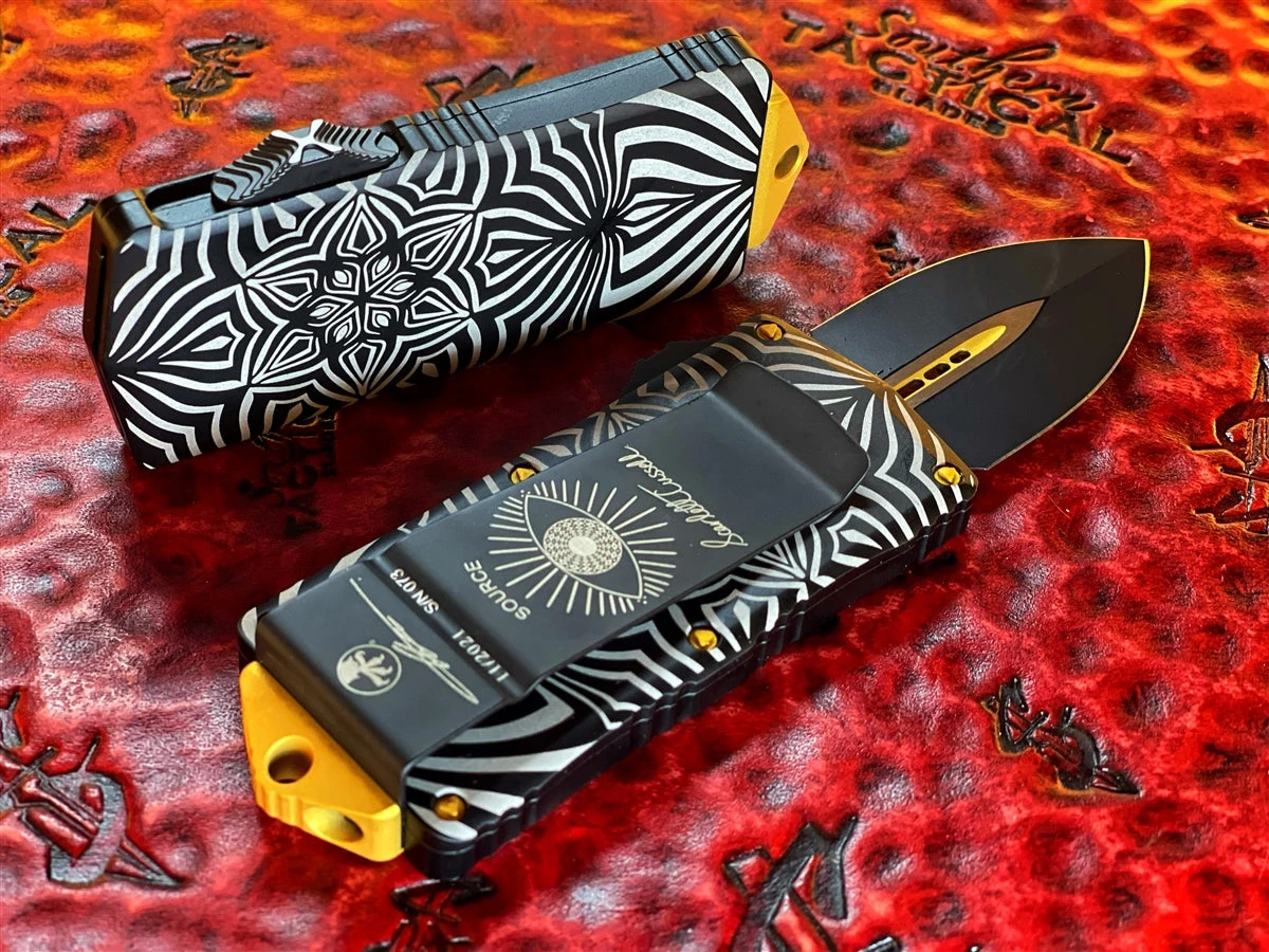 Microtech Exocet Double Edge, Two Toned Black W/ Gold Accents, Aircraft Allow W/ ‘Source’ Artwork 4 Microtech Exocet Double Edge, Two Toned Black W/ Gold Accents, Aircraft Allow W/ ‘Source’ Artwork - Image 2