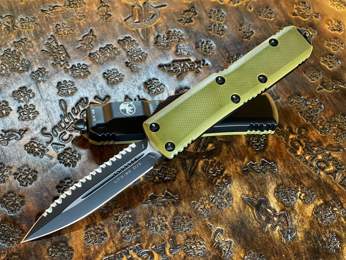 Microtech UTX-85 Double Edge Full Serrated G10 OD Green Top 3 Microtech UTX-85 Double Edge Full Serrated G10 OD Green Top