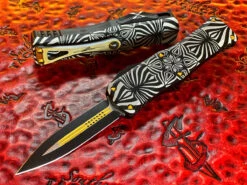 Microtech Hera Double Edge Two Toned Black W/ Gold Accents, Aircraft Alloy W/ ‘Source’ Artwork