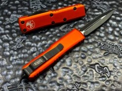 Microtech UTX85 Double Edge Full Serrated Orange -Southern Blades image 807ac071 6bd6 4d26 bf97 b91bc8c87675