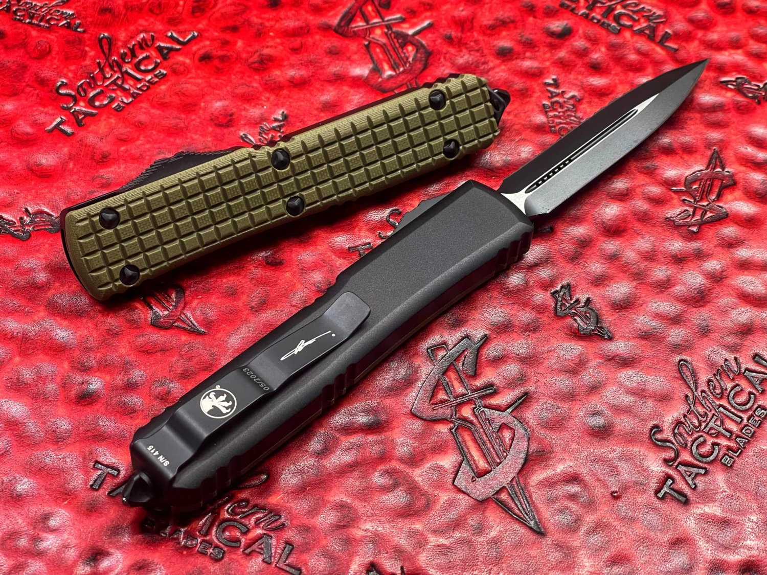 Microtech Ultratech D/E Full Serrated OD Green Frag G10 Top Signature Series OTF Knife 4 Microtech Ultratech D/E Full Serrated OD Green Frag G10 Top Signature Series OTF Knife - Image 2